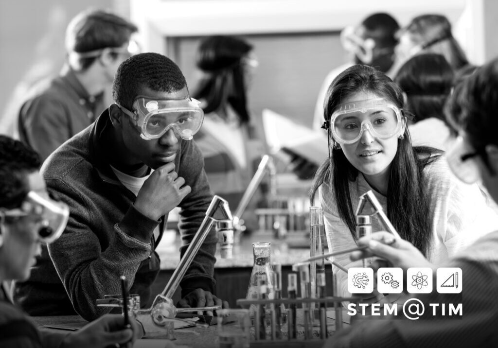 Students conducting science experiment in classroom.
